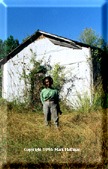 Annie Eggerson in front of the White Station schoolhouse